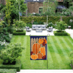 A large garden flag displayed in an open yard, ideal for spacious outdoor areas.
