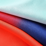 Various seasonal flag materials such as polyester, nylon, and cotton blend, displayed for comparison. Seasonal Flags and House Flags."